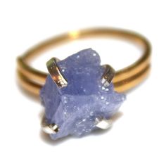 This raw tanzanite nugget ring is rustic and delicate! An gold vermeil shank with sterling silver prong ring is adorned with a lovely raw lavender nugget of natural tanzanite. This ring is adjustable but is best for ring sizes between 5 and 8 1/2. Love! xoxoxo payton For more cool jewelry looks, check out http://www.etsy.com/shop/FizzCandy All FizzCandy creations come beautifully boxed and ready for gift giving. Please see our store policies here - https://www.etsy.com/shop/FizzCandy/policy?ref= Gold Jewelry With Raw Stone For Promise Ring, Gold Ring With Raw Stone For Healing, Lavender Jewelry, Lavender Ring, Lavender Jewellery, Raw Tanzanite, Cool Jewelry, Prong Ring, Tanzanite Jewelry