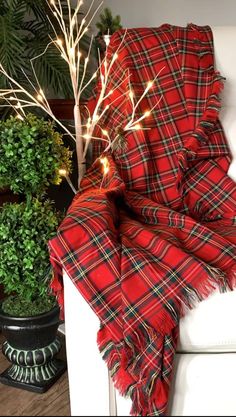 Add classic festive color to your sofa with this Royal Stewart tartan throw.  Toss the throw across your rocking chair for easy access when you settle in with a good book or simply want to watch the fireplace. This can even be used as an accent Christmas table cloth.  The perfect co worker Holiday gift that they will use year after year. This  polyviscose tartan throw is a single layer and comes in three sizes with an approximately 2 inch fringe on all four edges.  If you would like a different Burberry Tartan Tree, Flannel Christmas Blanket, New Years Eve Blanket, Plaid Sofa, Tartan Throws, Royal Stewart Tartan, Season Decor, Tartan Blanket, Stewart Tartan