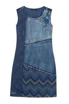 a dress made out of blue denim with an embroidered flower on the front and side