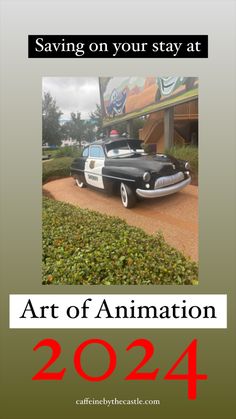 a car parked in front of a building with the words art of animation on it