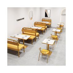 an empty restaurant with yellow chairs and tables