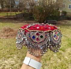 Handmade Afghan Halima Sultan Cap Head Jewelry Mathapatti ALERT!! Heavy Cap, heavily embellished A beautiful handmade afghan head jewelry is here. The afghan artisans residing in Pakistan make these beautiful caps. These are beautiful and one of a kind. There are vintage embellishments attached and beautiful hangings attached to the front. The cap covers the forehead, but it varies from person to person. This goes well with traditional afghan dresses and jewelry.  In addition, these can be perfe Afghan Jewelry Head Piece, Afghan Accessories, Afghani Suit, Afghan Hat, Vintage Embellishments, Afghani Jewelry, Afghan Jewellery, Halima Sultan, Afghan Women