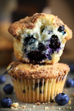 two blueberry muffins stacked on top of each other