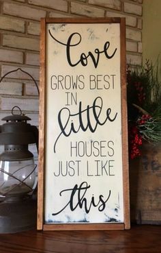 a sign that says love grows best in little houses just like this