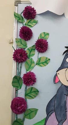 an image of a cartoon character with flowers on the side of a wall that has been painted