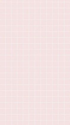 a pink and white tiled wall with vertical lines