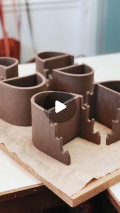 a video demonstrating how to make clay molds in the shape of castle towers and gates