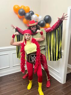 two people dressed in costumes posing for the camera