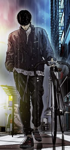 a man walking his bike in the rain