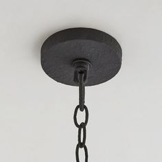 a black light fixture with a chain hanging from it's side