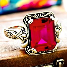 Indulge in the allure of vintage elegance with our stunning Vintage 4.50 Carat Vivid Red Lab Created Ruby Solitaire Filigree Ring. This captivating piece features a brilliant lab-created ruby, known for its striking vivid red hue that beautifully embodies timeless sophistication. Set in a delicately crafted filigree design, this ring is made from high-quality 925 solid sterling silver, ensuring durability and a lasting shine. The hallmark "925" guarantees the authenticity of the silver, making it a perfect addition to any jewelry collection or a thoughtful gift for someone special. Crafted with meticulous attention to detail, this vintage-inspired filigree ring showcases intricate patterns that enhance the captivating beauty of the centerpiece ruby. The generous 4.50 carat size offers a bo Vintage Ruby Ring With Filigree For Formal Events, Vintage Filigree Ring With Gemstone As A Gift, Vintage Red Ruby Ring With Intricate Design, Victorian Filigree Ring In Red As Gift, Ornate Hallmarked Ruby Ring As Gift, Victorian Style Filigree Ring In Red, Red Hallmarked Filigree Ring As Gift, Formal Red Rings With Intricate Design, Vintage Red Hallmarked Filigree Ring