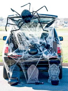 a car decorated with spider web and decorations