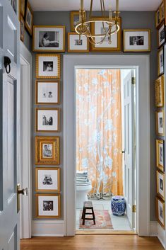 an entry way with pictures on the wall