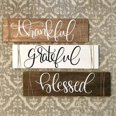 three wooden signs with the words grateful, grateful and blessed on them hanging on a wall