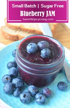 blueberry jam in a jar with fresh blueberries on the side