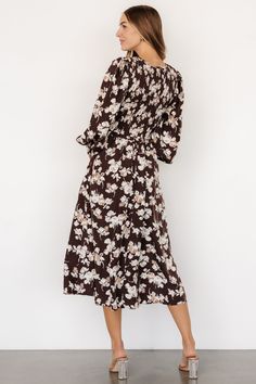 Baltic Born exclusive style Classic and beautiful, a great modest choice Soft woven material Deep Brown background with Neutral florals V-neckline Puffed sleeve, elastic cuff with small ruffle Smocked bodice Hidden side pockets Fully lined skirt, unlined bodice and sleeve Casey is 5'8, cup size 32B, size 2 and wearing size S Neutral Florals, Midi Dress Brown, Bridesmaids Gowns, Dresses Velvet, Velvet Dresses, Baltic Born, Midi Dress Style, Cozy Knit Sweater, Knit Sweaters