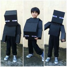 a young boy dressed up in a black box costume