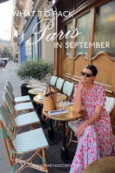 a woman sitting at a table in front of a building with the words, what to pack for paris in september