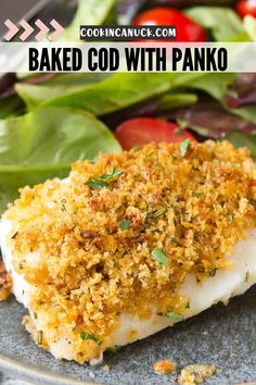 baked fish with parmesan bread crumbs on top and salad in the background