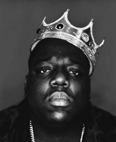 the front cover of rolling magazine featuring rapper biggie on the cover and his name in gold