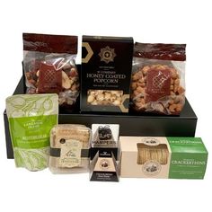 the gourmet hamper is packed with nuts, cheese and crackers to be eaten