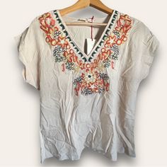 Solitaire Women’s Embroidered Blouse Top Beige Khaki Small New Condition: New With Tag Size: Small Color: Beige/Khaki Approx Measurements Bust: 20” Length: 26” Multicolor Floral Embroidered V-neck Top, Vacation V-neck Blouse With Embroidered Hem, V-neck Vacation Tops With Embroidered Hem, V-neck Blouse With Embroidered Hem For Vacation, Vacation V-neck Top With Embroidered Hem, V-neck Blouse With Multicolor Embroidery For Vacation, Beach V-neck Top With Embroidered Neckline, V-neck Tops With Geometric Embroidery For Vacation, Beige Embroidered V-neck Top