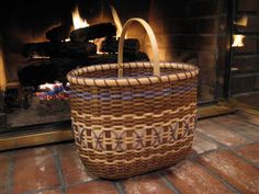 a wicker basket sitting on top of a brick fireplace