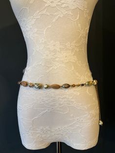 High quality metal chain & Marble Bead belt.  Exclusively designed by FAN Design, this belt is made to a wide range of sizes. Matching necklace also available.  Choose your waist size in inches, all belts will come with an extra 12 inch hanging chain Tap into the hottest new trend with chain belts! This chic piece of bodywear can be draped over your clothing to enhance your outfit or worn with bare midriff looks. Pair it with a simple black ensemble for an elegant finish. Perfect accessory for a Bohemian Style Adjustable Chain Belt, Bohemian Adjustable Chain Belt, Bohemian Beaded Waist Chain, Bead Belt, Elegant Swimwear, Beads Fashion, Belt Vintage, Chain Belts, Beaded Belt