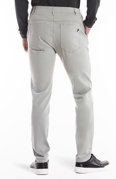 Stay comfy on or off the course in nylon performance pants built with stretch and a roomier fit that slightly tapers off at the ankle. The secure zip pocket helps safely store smaller essentials so you can keep your focus on the game. Zip fly with button closure Front slant pockets; hidden side-zip pocket; back welt pockets 88% nylon, 12% spandex Machine wash, tumble dry Imported Moisture-wicking Tapered Leg Pants With 4-way Stretch, Functional Straight Leg 4-way Stretch Pants, Functional Straight Leg Pants With 4-way Stretch, Versatile Nylon Pants With 4-way Stretch, Midweight Nylon Pants With Functional Pockets, Golf Bottoms With Pockets And 4-way Stretch, Versatile 4-way Stretch Pants With Functional Pockets, Functional Moisture-wicking Bottoms For Golf, Functional 4-way Stretch Tapered Leg Pants