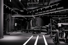 an empty gym room with black and white colors