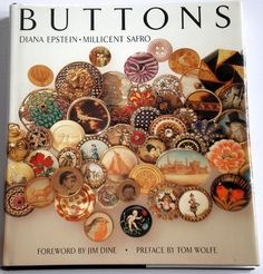 a book with buttons on it and the title's page in front of it