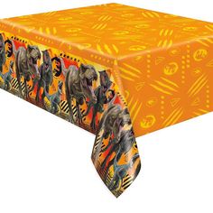 an orange tablecloth with elephants on it and other animal images in the background,