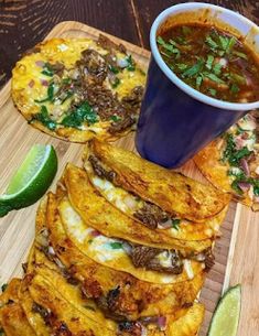 mexican food with tortillas and salsa on a cutting board