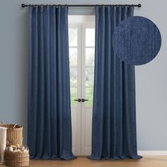 the blue curtains are hanging in front of a white door