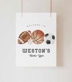 a welcome sign hanging on a wall with basketballs, soccer balls and football shoes