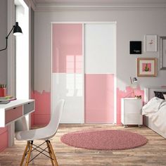 a pink and grey bedroom with a white desk