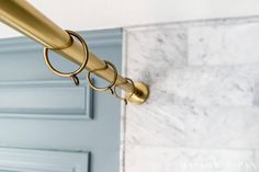 a close up of a door handle on a blue door