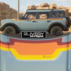 an suv is parked in front of a rock formation with the words avery wars on it