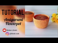 two woven baskets sitting on top of a table next to yellow flowers and a vase