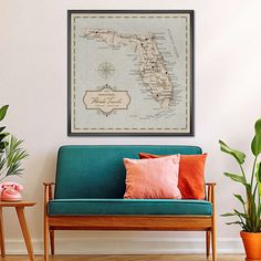 a living room with a blue couch and potted plants