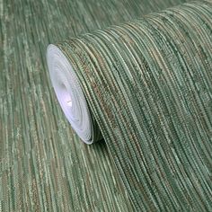 a roll of green and brown striped wallpaper