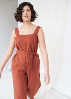 "SIZING & FIT This garment is true to size, and we recommend choosing the size you usually wear. If you want the garment to be loose-fitting, choose a larger size than you usually wear. Before placing an order, check the approximate measurements of the finished garment given below. Model is 5′9″ (175cm) tall with a 97cm/38″ bust, 71cm/28″ waist, 109cm/43″ hip, and she is wearing an L in terracotta. XS Length ± 134cm | 52.7\" Shoulder crotch length ± 76cm | 29.9\" Bust ± 90cm | 35.4\" Hips ± Brown Relaxed Fit Overall Jumpsuit, Brown Relaxed Fit Jumpsuit Overall, Brown Relaxed Fit Jumpsuit, Brown Relaxed Fit Overalls, Terracotta Jumpsuit, Women Linen Clothing, Jumpsuit Linen, Work Jumpsuit, Oversized Jumpsuit