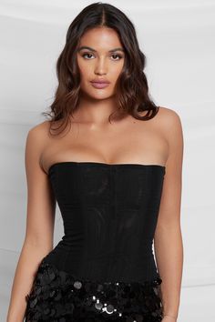 Meet our Muse Mesh Corset Top - a modern sleek black mesh corset top with simple flattering vertical wire boning. Designed to sculpt and shape, this corset top features a double layered non-stretch mesh material providing an extreme high level of support to lift your bust and cinch your waist.Featuring a rounded hemline, back zipper and a strapless neckline, our Muse Mesh Corset Top does not disappoint. If you are looking for the perfect black corset top that will go with (literally) anything, t Black Mesh Corset, Satin Corset Top, High Waist Long Skirt, Black Corset Top, Mesh Corset, Strapless Corset, Trendy Top, Black Corset, Edgy Look