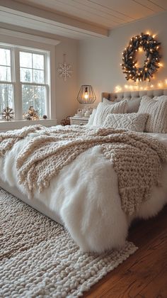 a bed with white fur and lights on the headboard is in front of a window