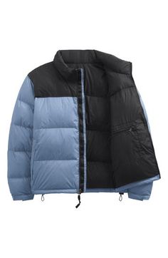 A retro North Face jacket based on a baffle-quilted, down-insulated design from 1996 offers unmatched warmth in cold weather. The durable ripstop shell with 700-fill-power down insulation is perfect for backpacking and has a packable design that can be stowed in its own pocket. 27" length (size XX-Large) Stand collar; stowaway hood Packs into pocket 40-denier 57 g/m² ripstop shell with non-PFC durable water-repellent (non-PFC DWR) finish Lined, with 700-fill-power down insulation 100% nylon Mach The North Face 1996 Retro Nuptse, The North Face 1996, North Face 1996, Waterproof Parka, Mauna Kea, Packable Jacket, North Face Women, North Face Jacket, Stand Collar