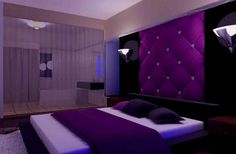 a purple and black bedroom with white walls