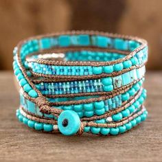 Soothing Teal Wrap Bracelet Crafted by Artisan Group - Soothing Teal | NOVICA Blue Spiritual Wrap Bracelet With Gemstone Beads, Spiritual Blue Gemstone Beads Wrap Bracelet, Spiritual Blue Wrap Bracelet With Gemstone Beads, Blue Bohemian Bracelets For Meditation, Blue Bohemian Beaded Bracelets For Meditation, Bohemian Blue Beaded Bracelets For Meditation, Bohemian Blue Bracelets For Meditation, Blue Gemstone Beads Festival Bracelet, Bohemian Turquoise Wrap Bracelet With Gemstone Beads