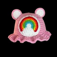 a crocheted bear hat with a rainbow on it