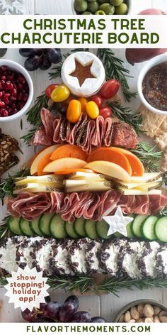 a christmas tree shaped platter with meats and vegetables