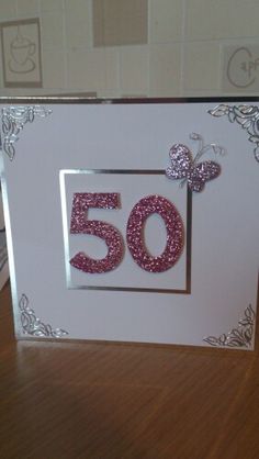 a birthday card with the number 50 in pink glitter and a minnie mouse on it